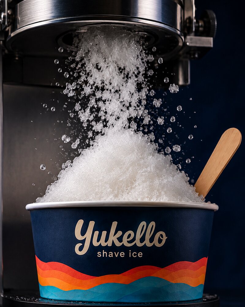 Fine snow falling from the shaver into a navy Yukello bowl